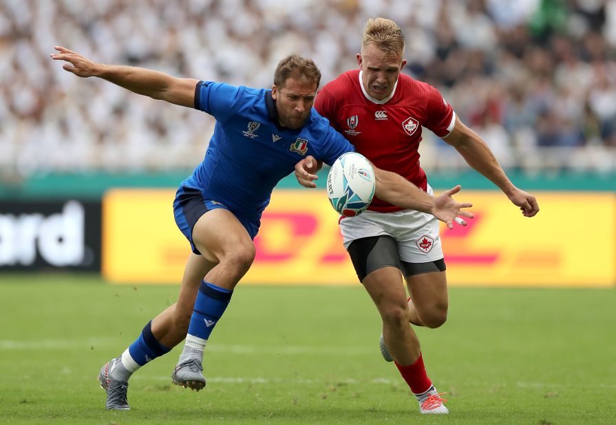 Tommaso Benvenuti of Italy competes for the ball with Ben Lesage of Canada.