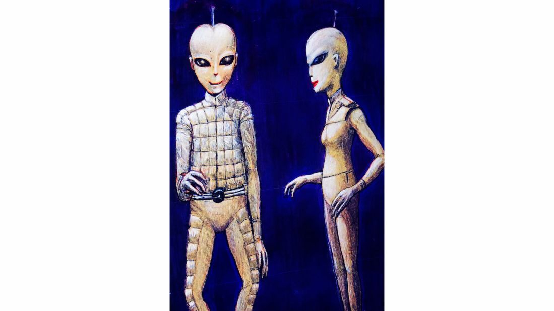 <strong>An artist's conception: </strong>Follwers describe the aliens as slender, little, silvery humanoids. An artist's conception, displayed in Wassana's home, portrays them standing upright on two legs, with two arms.<br />