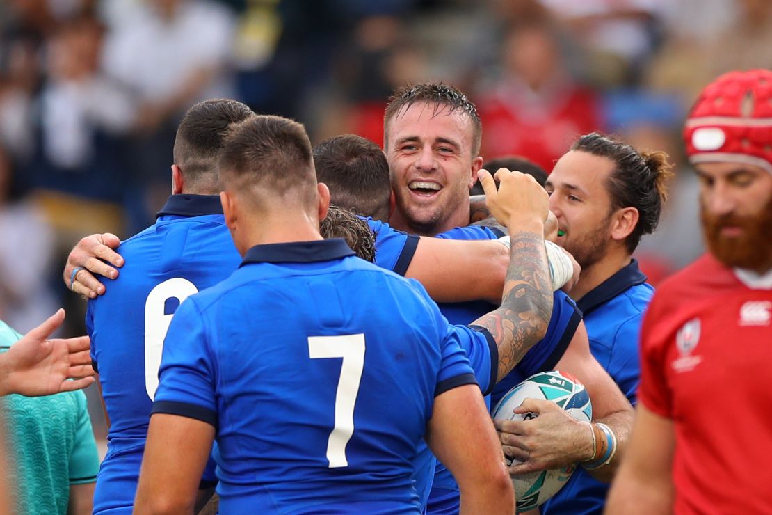 Italy celebrates during its win over Canada. 