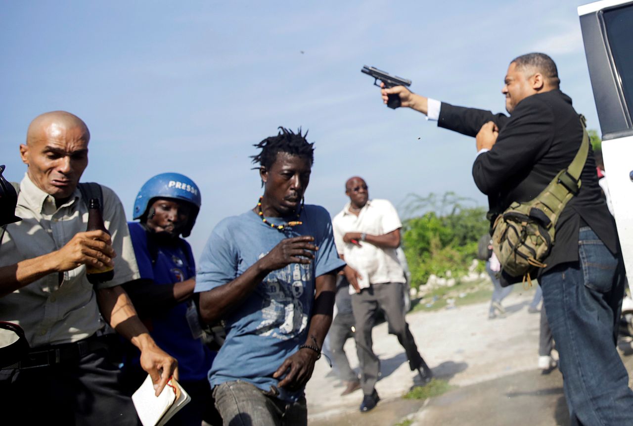 Haitian Senator Ralph Fethiere fires a gun in the air to disperse protesters outside the country's Parliament building on Monday, September 23. An Associated Press photographer, Dieu-Nalio Chery, <a href="https://www.cnn.com/2019/09/24/americas/haiti-photographer-shot-intl-hnk/index.html" target="_blank">was wounded during the commotion,</a> but it was not immediately clear whether Chery was injured by Fethiere or if others were also firing guns. The chaotic scenes follow recent protests over fuel and food shortages, <a href="https://www.reuters.com/article/us-haiti-politics/haiti-legislator-fires-handgun-at-protest-photojournalist-injured-idUSKBN1W908J" target="_blank" target="_blank">Reuters reported.</a> Haiti has been struggling with power blackouts and rising fuel prices, sparking public anger against the government.