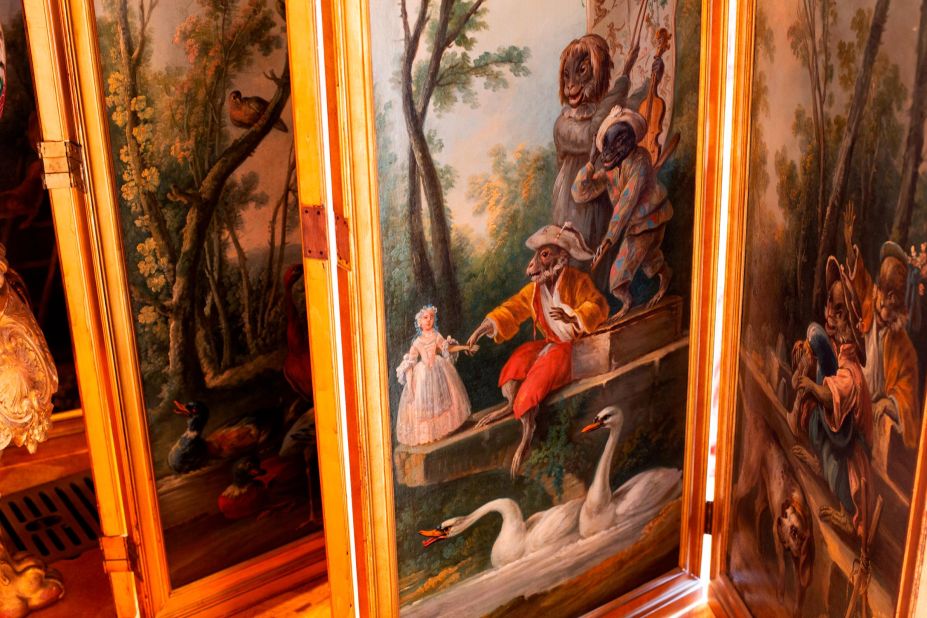 As soon as they enter the house, visitors are greeted by the vast and, in places, unusual collection, including this screen with pictures of monkeys in human dress.