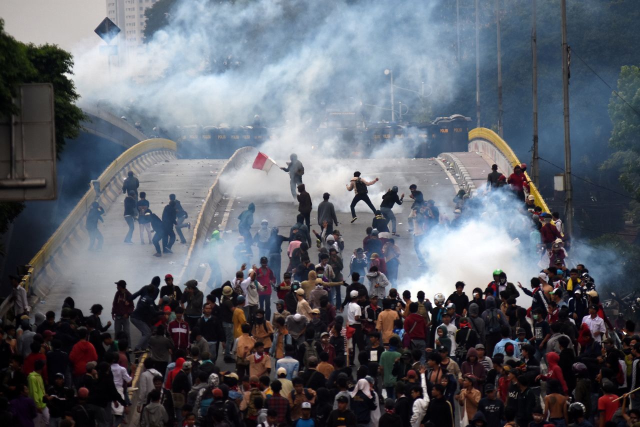 Students clash with police during a protest in Jakarta, Indonesia, on Wednesday, September 25. Thousands of students took to the streets to protest <a href="https://www.cnn.com/2019/09/25/asia/indonesia-protests-criminal-code-intl-hnk/index.html" target="_blank">a proposed criminal code</a> that would usher in a raft of controversial new laws. The code would make consensual sex outside of marriage illegal, and it would effectively outlaw same-sex relations. It would also impose a possible jail sentence for anyone who helped a woman terminate her pregnancy.