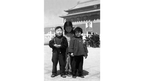 4-year-old Xiao Jianwen and his elder sister standing with a neighborhood girl in Tiananmen Square in 1953.