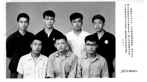 Xiao (bottom right) and his fellow workers at the Beijing Construction Materials Factory in 1969, during the Cultural Revolution.
A Mao quote is printed on the side: "We must give full play to the leadership role of workers during the Cultural Revolution."