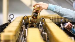 A worker checks a jar of Nescafe Gold Blend instant coffee on the production line at the Nescafe factory, operated by Nestle SA, in Tutbury, U.K., on Thursday, Aug. 23, 2018. European consumer-goods giants ranging from Nestle SA to Anheuser-Busch InBev NV and Diageo Plc are stepping up their response to activist threats by cutting costs, shedding underperforming brands and returning cash to investors. Photographer: Simon Dawson/Bloomberg via Getty Images