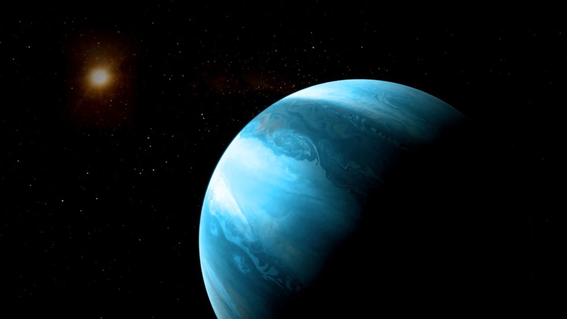 A Jupiter-like planet with a blueish colour orbiting a cool red dwarf.