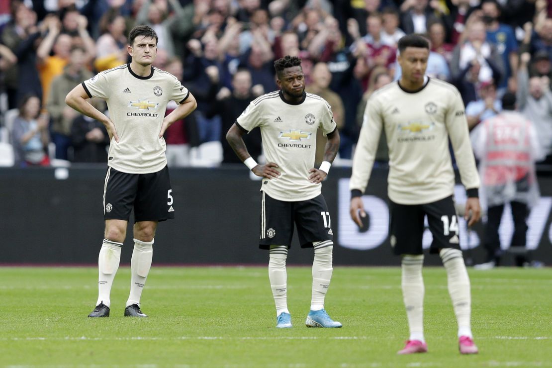 Fred (C) of Manchester United looks dejected with Harry Maguire (L) during September's defeat at West Ham.