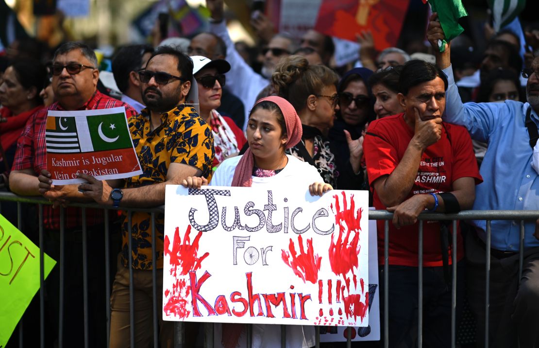 People gather during a protest in solidarity with the people of Kashmir outside the United Nations.