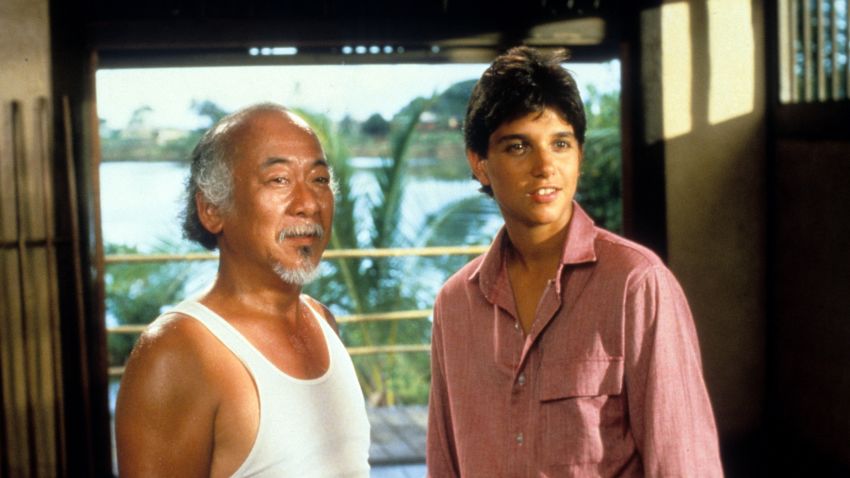 Pat Morita and Ralph Macchio in a scene from the film 'The Karate Kid', 1984. (Photo by Columbia Pictures/Getty Images)