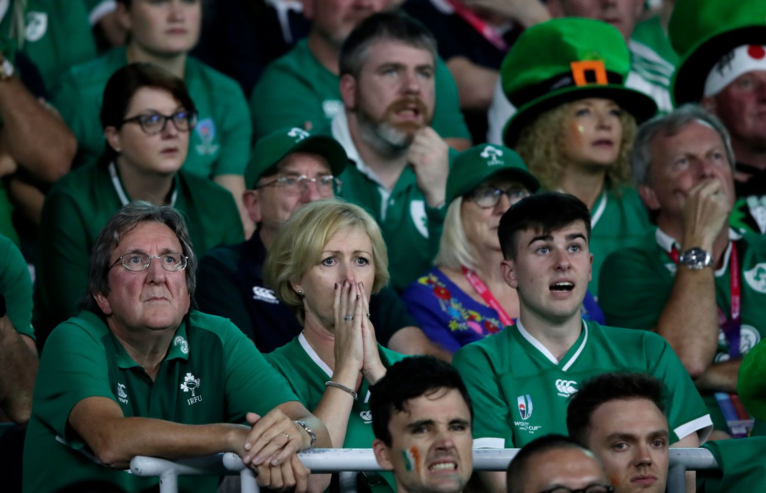 Irish fans react as they watch their side slide to a shock defeat to host Japan.