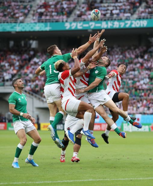 Ireland players Gary Ringrose (l) and Jack Carty (r) compete for a high ball during the Rugby World Cup 2019 Group A game between Japan and Ireland.