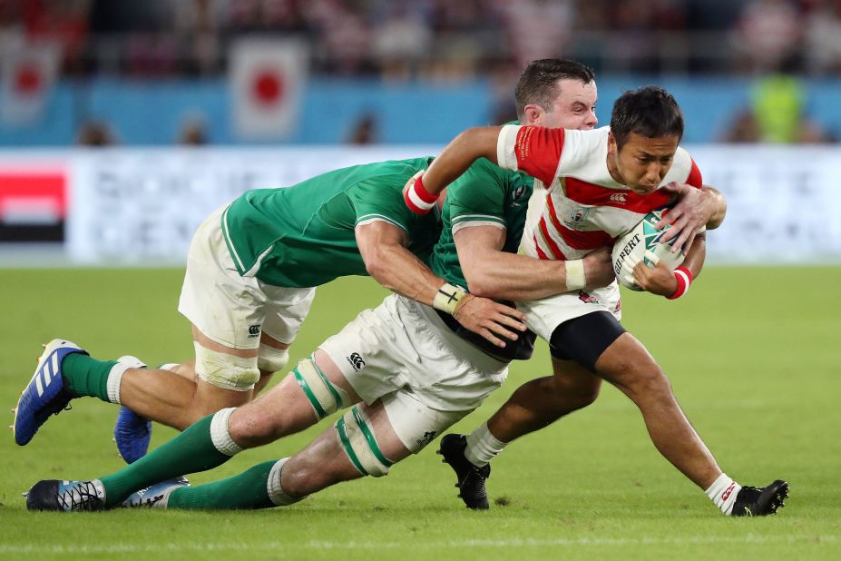 Yutaka Nagare of Japan is tackled by James Ryan of Ireland during the hard-fought encounter