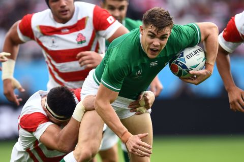 Ireland's centre and first half try scorer Garry Ringrose is tackled by Japan's lock Luke Thompson as the action hots up in Shizuoka.