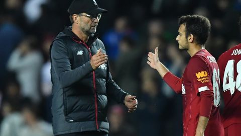 Liverpool's manager Jurgen Klopp celebrates with Spanish midfielder Pedro Chirivella at the final whistle of the English League Cup win over MK Dons. 