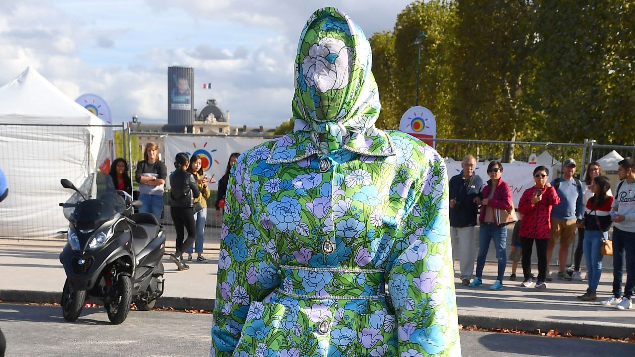 Cardi B wearing Richard Quinn at the Eiffel Tower.