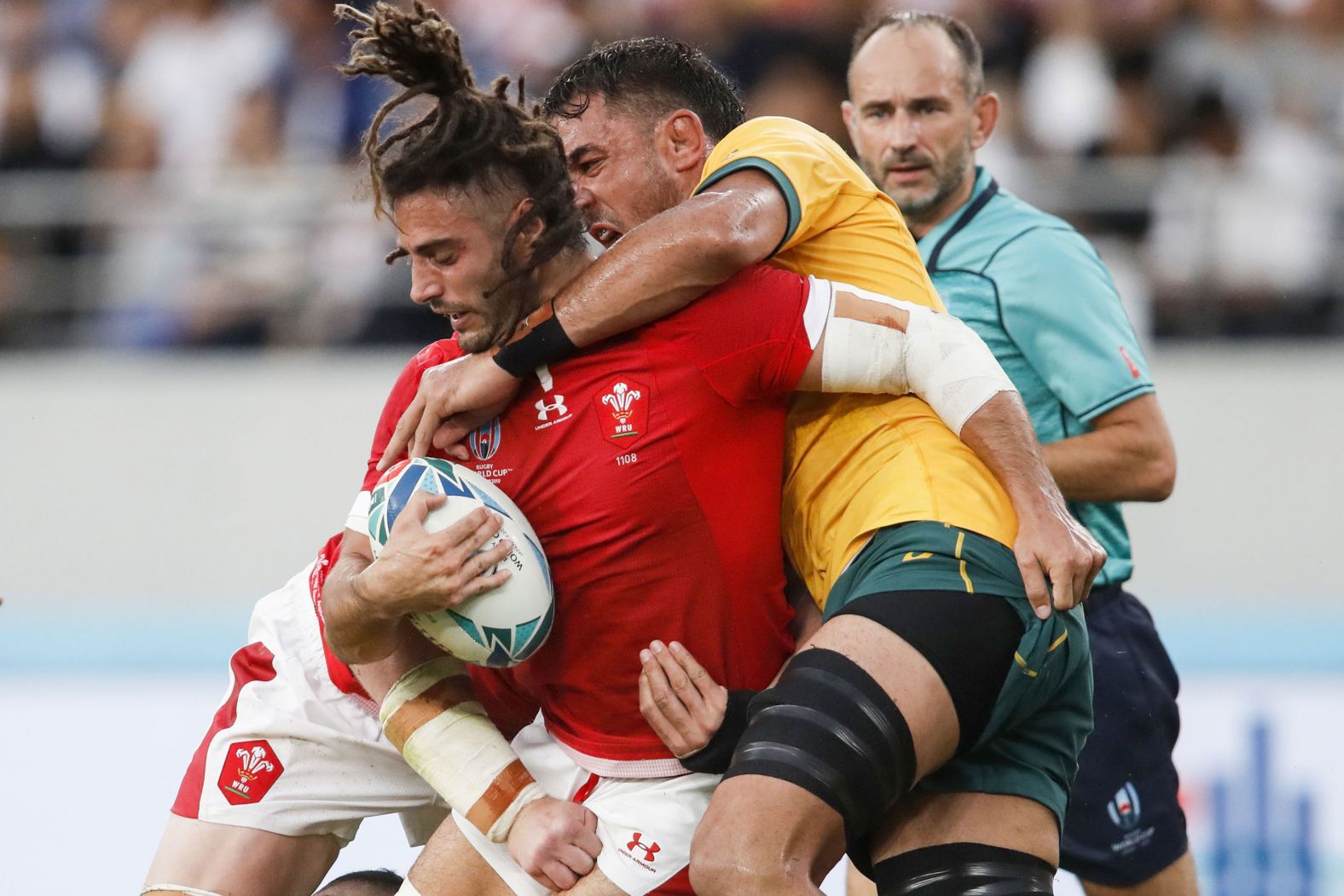 Wales' No. 8 Josh Navidi (left) is tackled by Australia's lock Izack Rodda during an epic encounter.