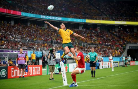 Dane Haylett-Petty of Australia jumps for the ball under pressure from Liam Williams of Wales.