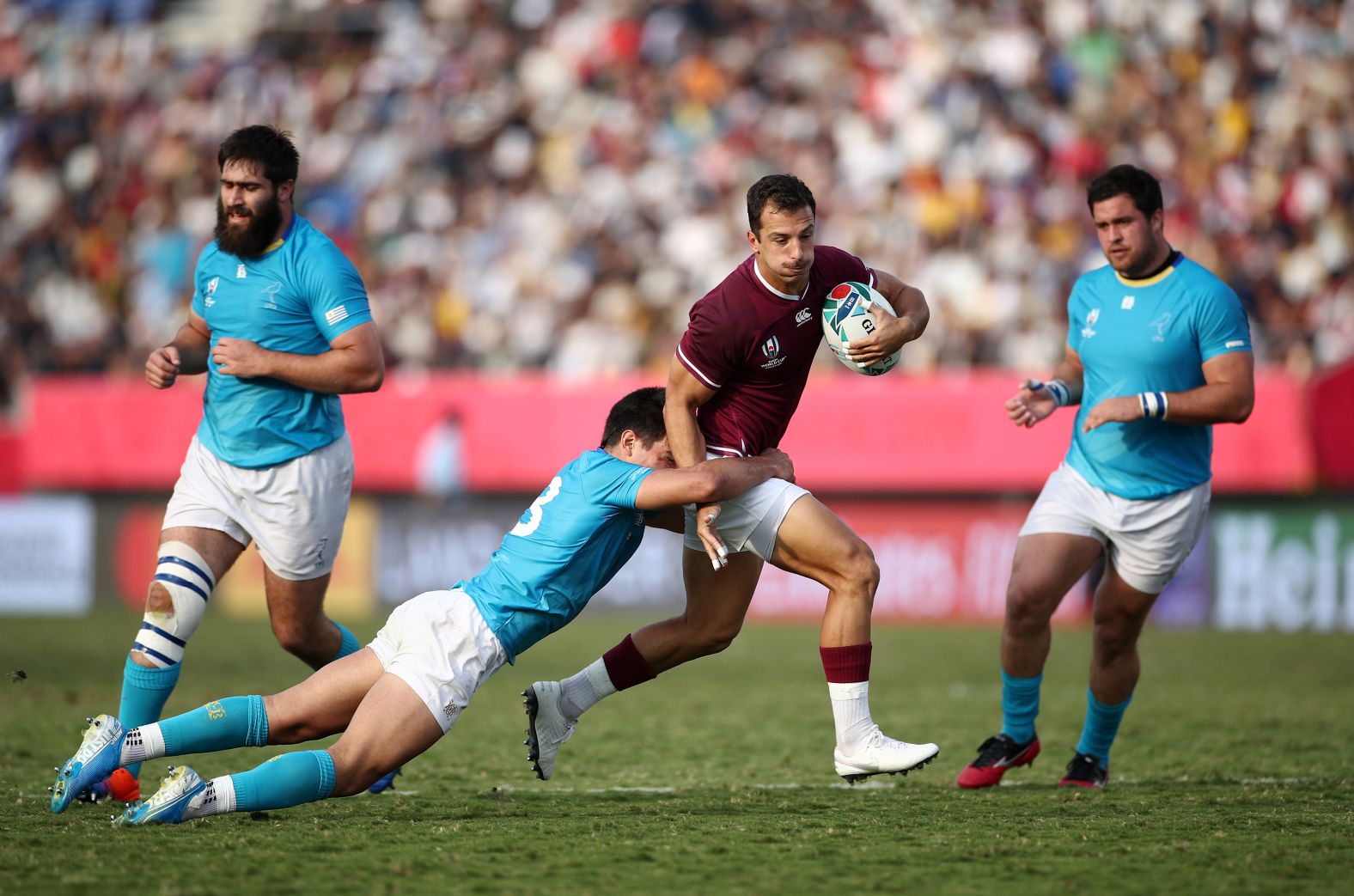 Soso Matiashvili of Georgia breaks through a tackle against Uruguay.