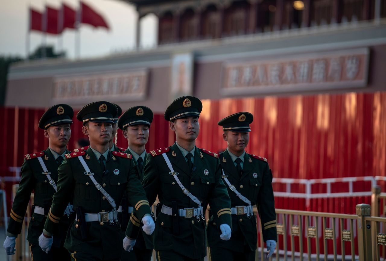 Chinese paramilitary police personnel march in front of the Tiananmen gate in Beijing ahead of the 70th anniversary of the founding of the People's Republic of China on September 26.
