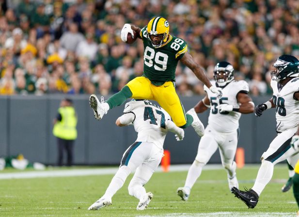 Green Bay Packers tight end Mercedes Lewis hurdles over Philadelphia Eagles linebacker Nathan Gerry during the second quarter of their NFL game at Lambeau Field in Green Bay, Wisconsin, on September 26.
