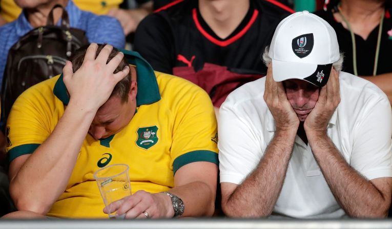 Dejected Australian supporters react following Australia's loss to Wales in their Rugby World Cup Pool D match in Tokyo on September 29.
