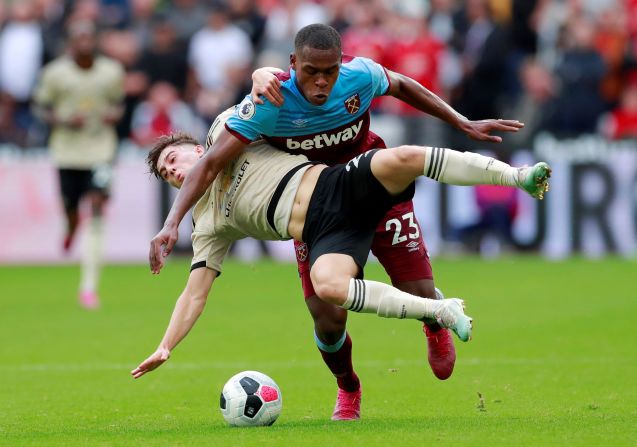 West Ham United's Issa Diop tackles Manchester United's Daniel James during their Premier League match in London on September 22.