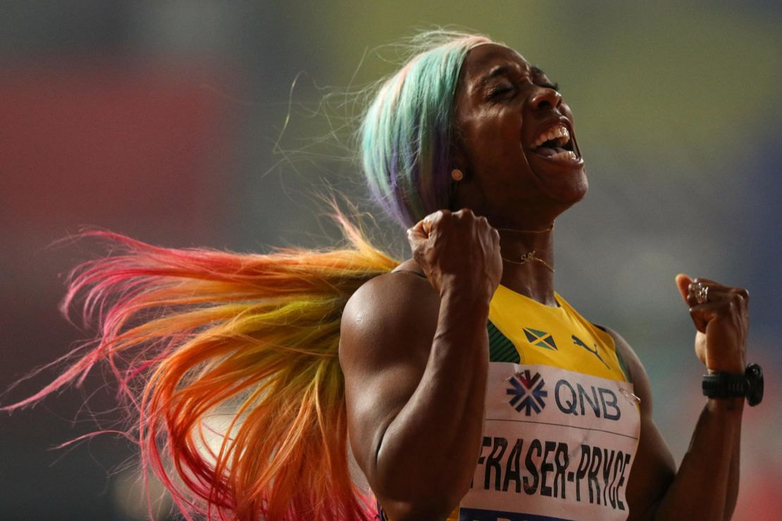 Shelly-Ann Fraser-Pryce celebrates winning the women's 100m final at the World Athletics Championships.