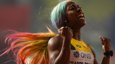 Shelly-Ann Fraser-Pryce celebrates winning the women's 100m final at the World Athletics Championships.