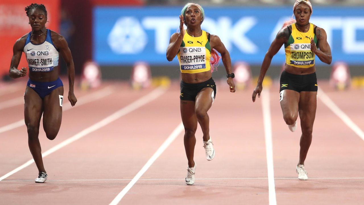 Fraser-Pryce held off the challenge of Britain's Dina Asher-Smith (L)