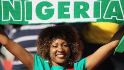 JOHANNESBURG, SOUTH AFRICA - JUNE 12: A Nigeria fan proudly holds her scarf ahead of the 2010 FIFA World Cup South Africa Group B match between Argentina and Nigeria at Ellis Park Stadium on June 12, 2010 in Johannesburg, South Africa. (Photo by Christof Koepsel/Getty Images)