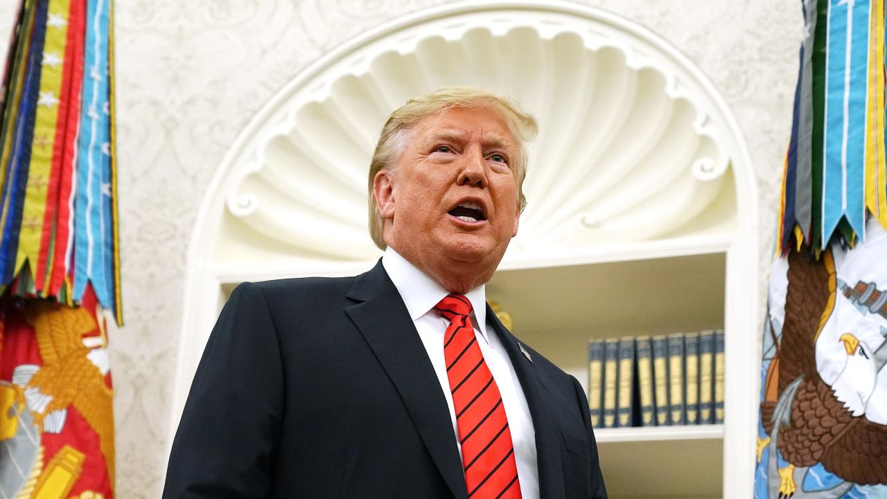 President Donald Trump gives pauses to answer a reporters' question about a whistleblower as he leaves the Oval Office after hosting the ceremonial swearing in of Labor Secretary Eugene Scalia at the White House September 30, 2019 in Washington, DC.