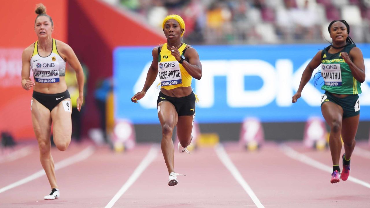 Gina Lückenkemper (left) competes in the women's 100 meters heats at the Khalifa International Stadium in Doha, Qatar on September 28, 2019.