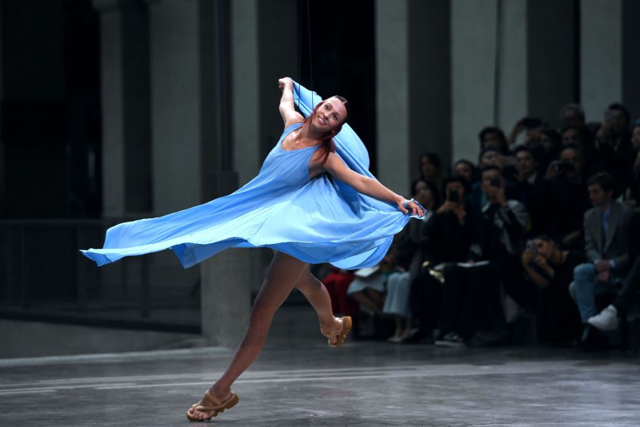 A model danced as she presented a creation for Issey Miyake.
