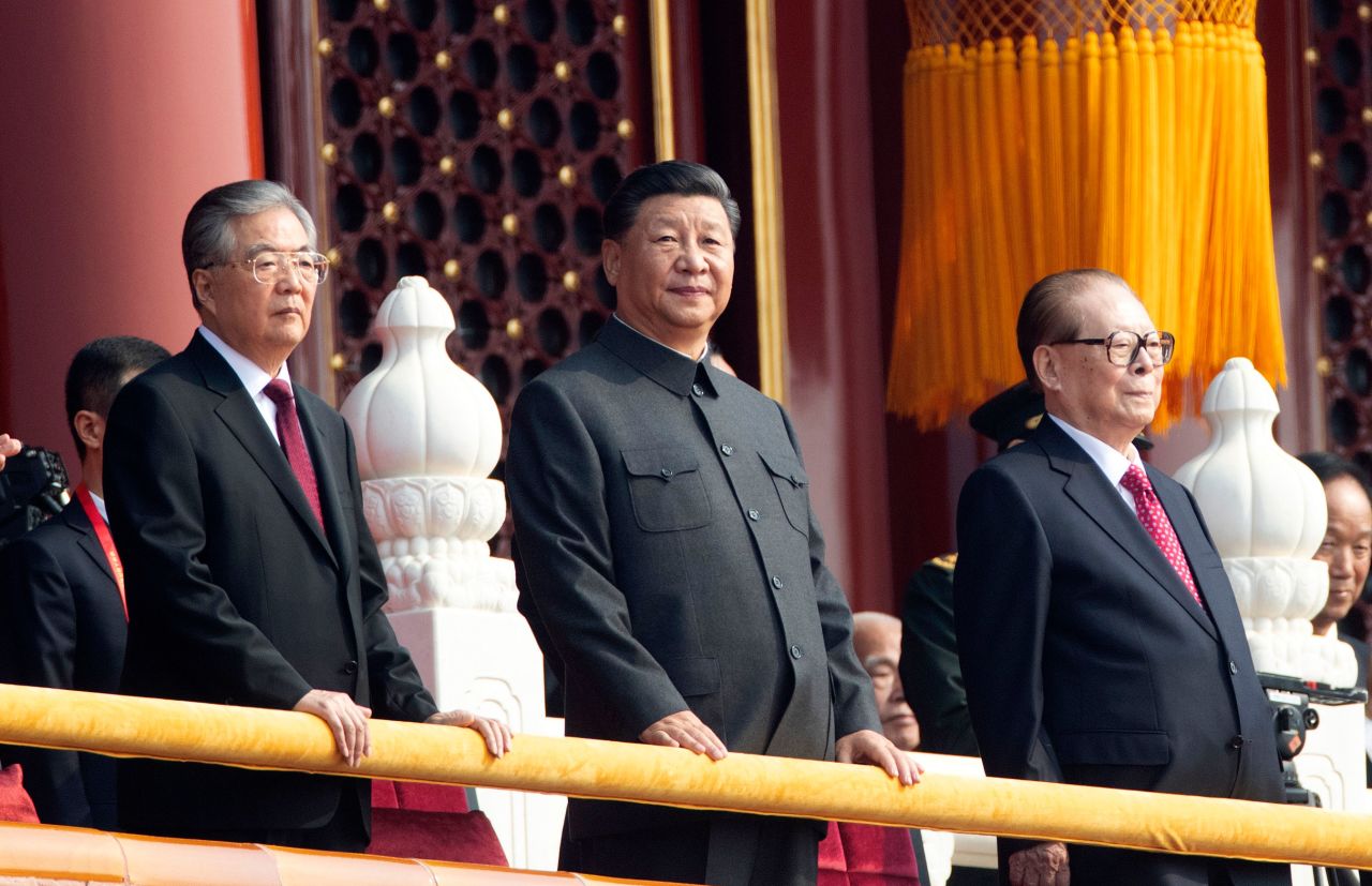 Chinese President Xi Jinping, center, with former presidents Jiang Zemin, right, and Hu Jintao, left, attend the celebration in Beijing.
