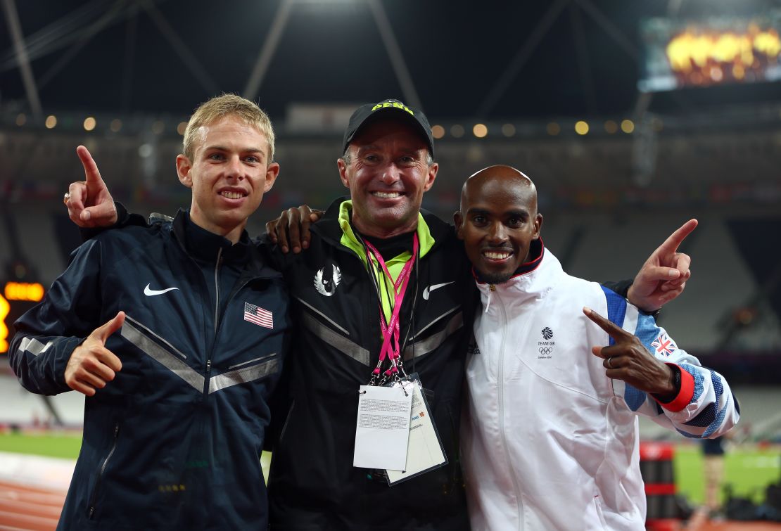 Salazar (center) celebrates gold and silver medals for Mo Farah (right) and Galen Rupp (left) at the 2012 Olympics.  