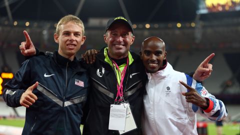 Salazar (center) celebrates gold and silver medals for Mo Farah (right) and Galen Rupp (left) at the 2012 Olympics.  