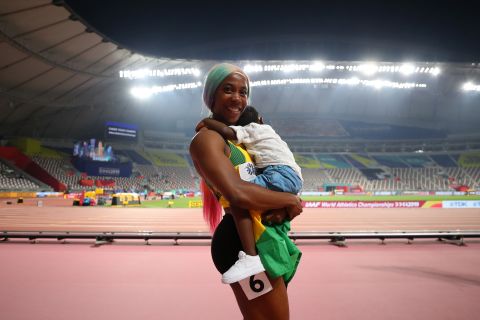 Shelly-Ann Fraser-Pryce celebrates with her son Zyon after winning the women's 100 meters final, but the empty stands have caused controversy. 