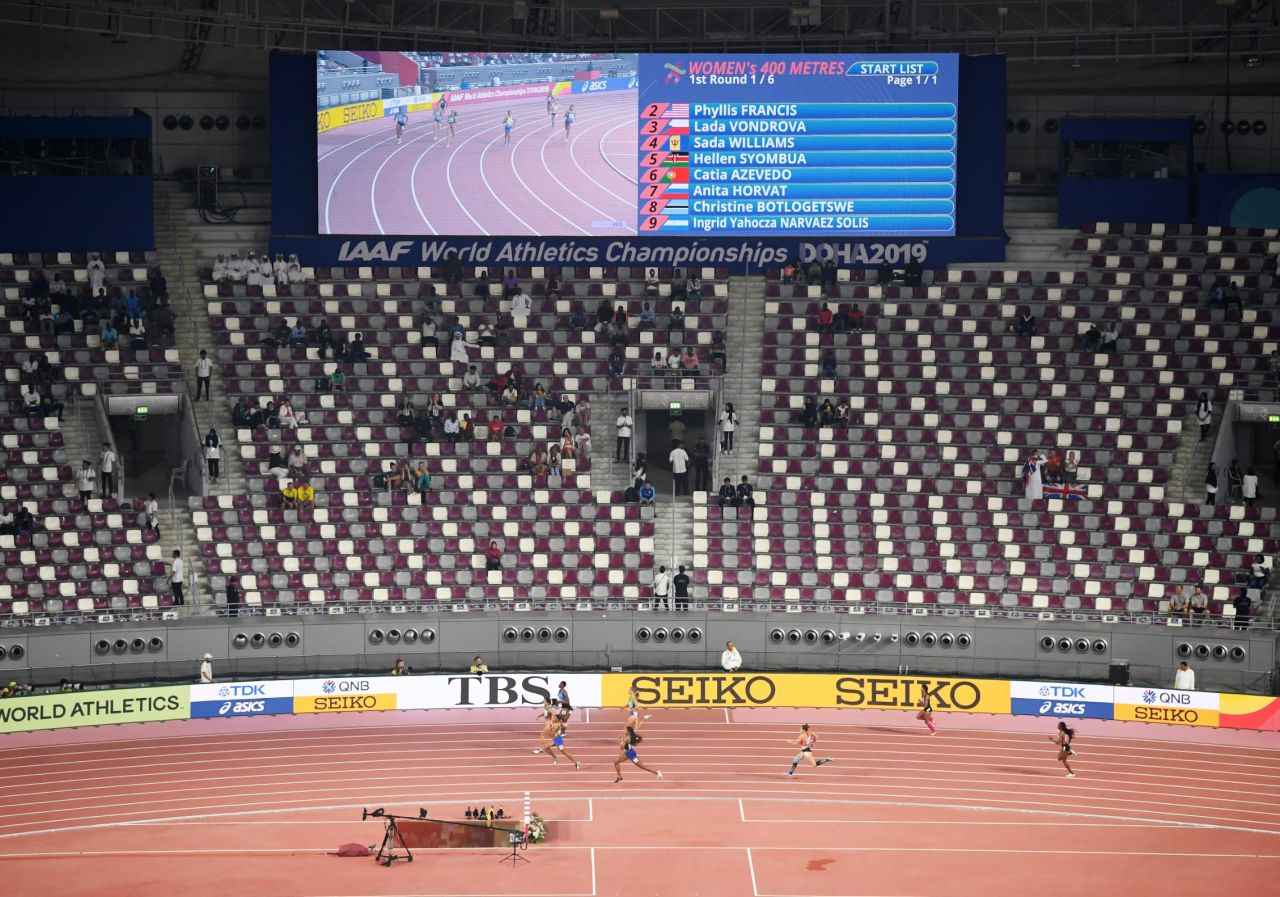 Spectators spread out to watch the heats of the women's 400 meters.