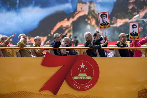 Veterans and relatives of revolutionary martyrs take part in the National Day parade in Tiananmen Square.
