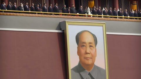 Chinese leaders including President Xi Jinping, center, stand on Tiananmen Gate above the large portrait of the late Chinese leader Mao Zedong.