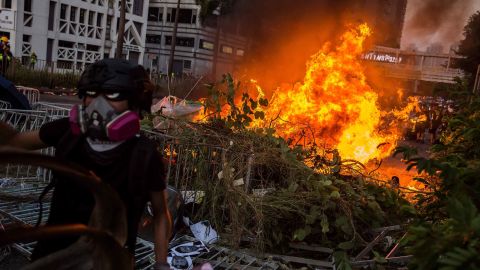 A fire lit by protesters burns in the Sha Tin district of Hong Kong.