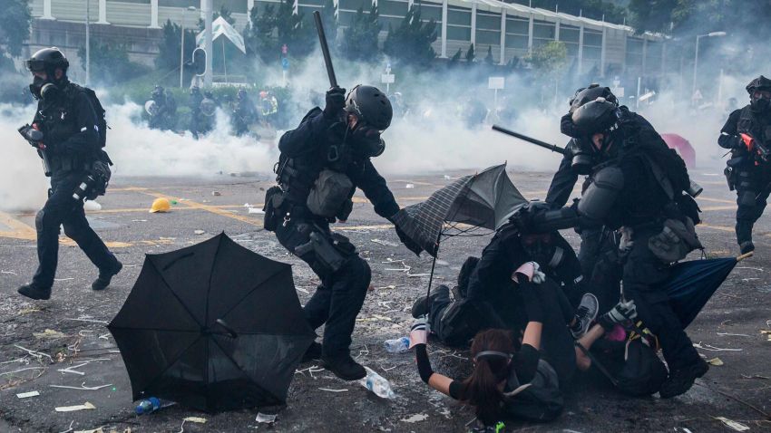 Police detain demonstrators in the Sha Tin district of Hong Kong on October 1, 2019, as violent demonstrations take place in the streets of the city on the National Day holiday to mark the 70th anniversary of communist China's founding. - Strife-torn Hong Kong on October 1 marked the 70th anniversary of communist China's founding with defiant "Day of Grief" protests and fresh clashes with police as pro-democracy activists ignored a ban and took to the streets across the city. (Photo by ISAAC LAWRENCE / AFP)        (Photo credit should read ISAAC LAWRENCE/AFP/Getty Images)