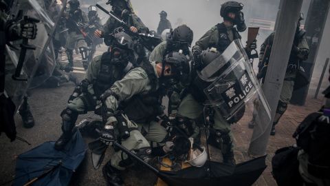 Police tackle and arrest  protesters during clashes in Hong Kong's Wan Chai district on October 1, 2019.