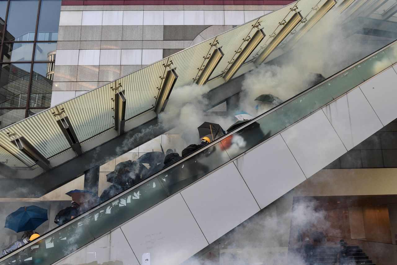 Protesters react after police fired tear gas near the central government offices in Hong Kong's Admiralty area on October 1.