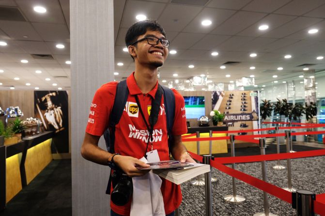 <strong>Local fans: </strong>Putera Dyann, 19, pictured at a driver signing event for fans. He is hoping a Ferrari driver will sign a steering wheel he brought along.