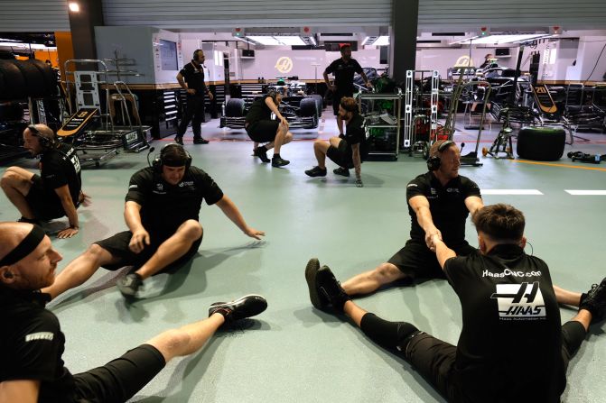 <strong>Pit prep: </strong>F1 engineers from the Haas Formula One team get ready to practice a quick tire change.  
