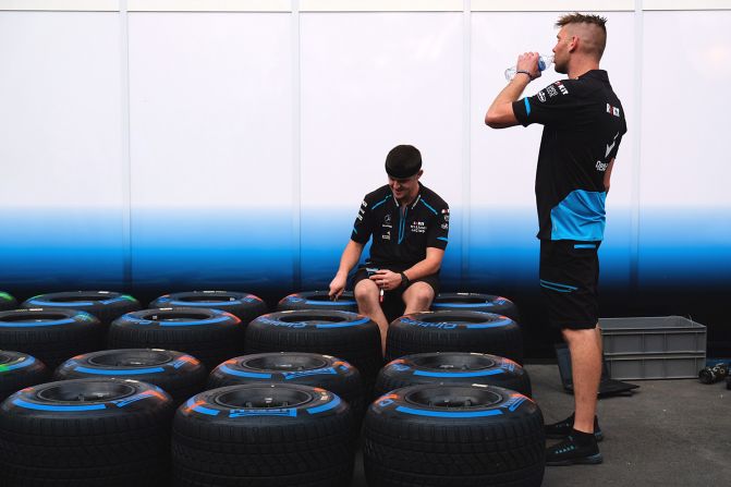 <strong>Behind-the-scenes: </strong>Mechanics take a rest outside a Formula One garage at the Singapore Grand Prix.  