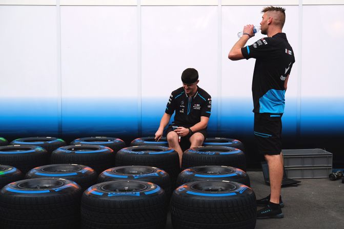<strong>Behind-the-scenes: </strong>Mechanics take a rest outside a Formula One garage at the Singapore Grand Prix.