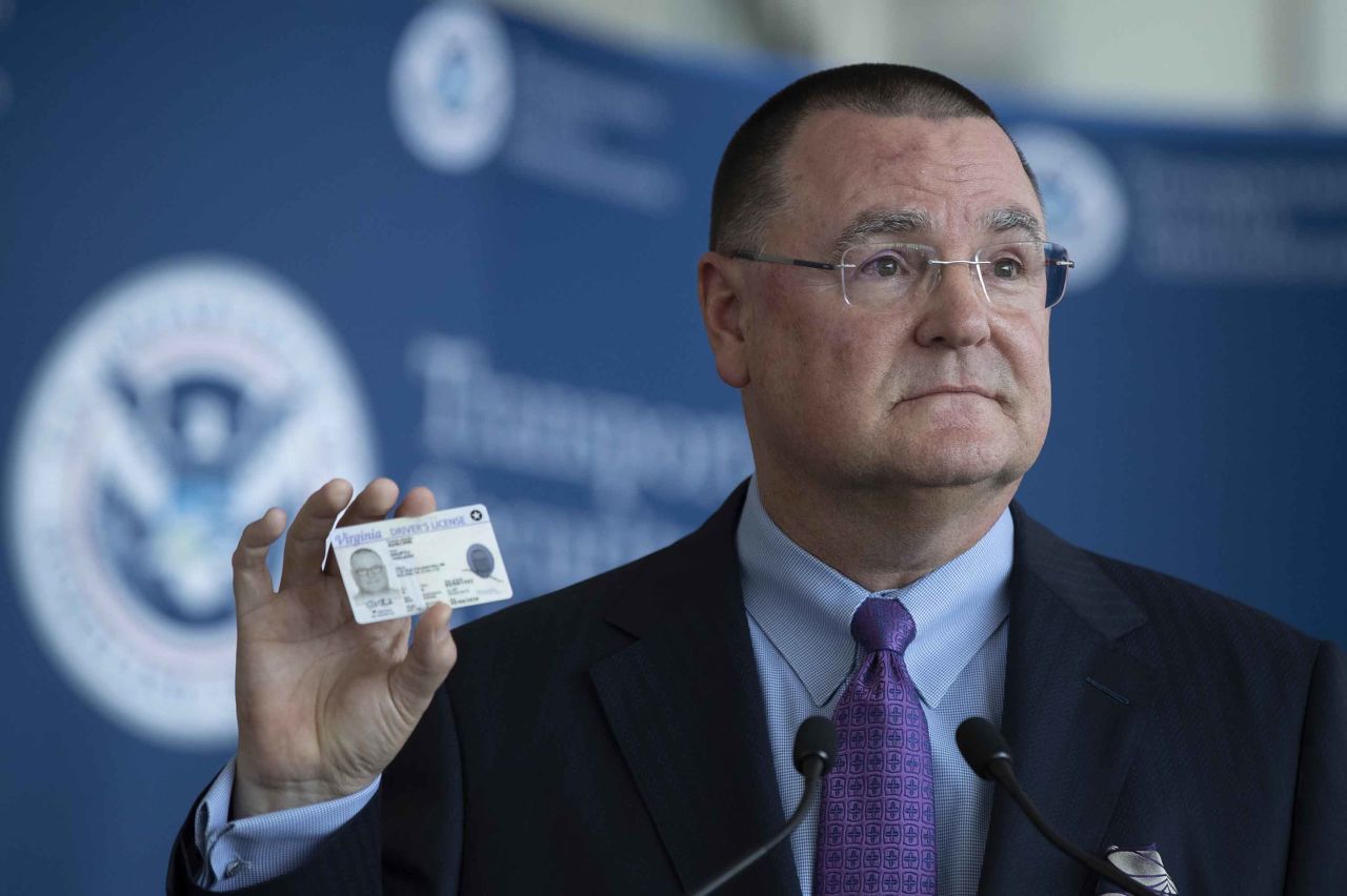 Todd Hauptli, CEO of the American Association of Airport Executives, shows his REAL ID-compliant driver's license during a news conference at Ronald Reagan Washington National Airport on October 1, 2019. 