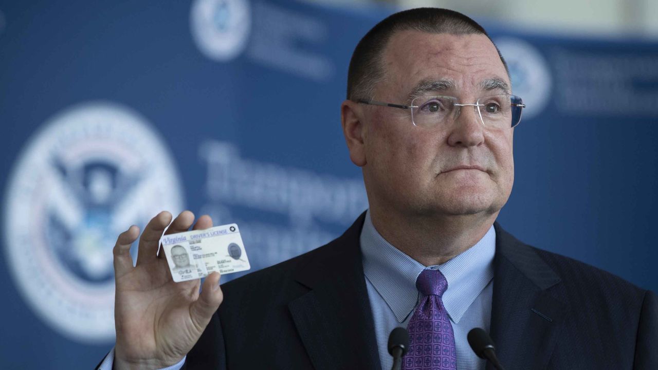 Todd Hauptli, CEO of the American Association of Airport Executives, shows his REAL ID-compliant driver's license during a news conference at Ronald Reagan Washington National Airport on October 1, 2019. 